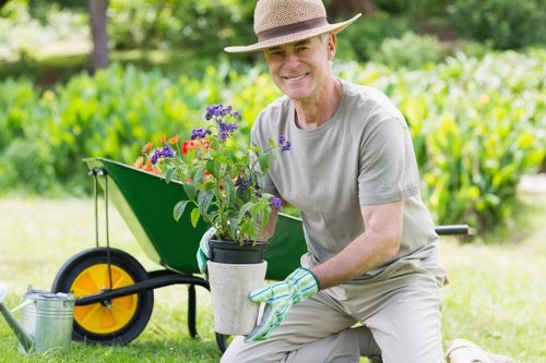 Gardener and client discussing accessible planting choices at the end of a job